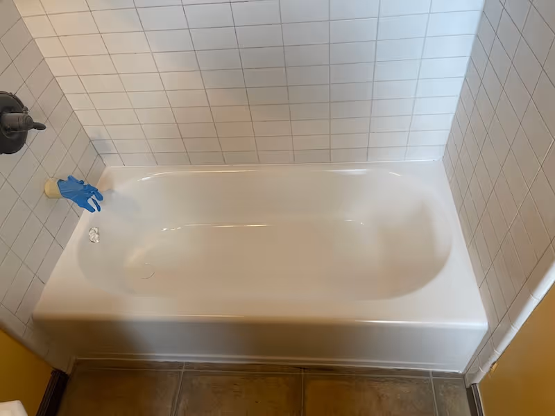 Refinished bathtub with clean white glaze coating — Bay Area reglazing service